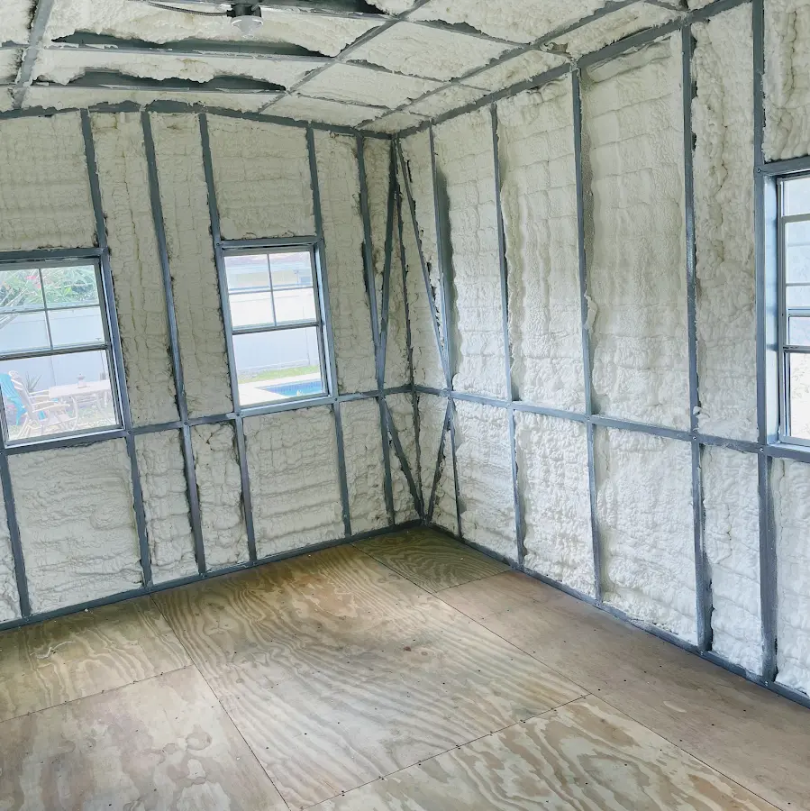 Closed-cell spray foam insulation applied to wall cavities in a residential project in Raymore